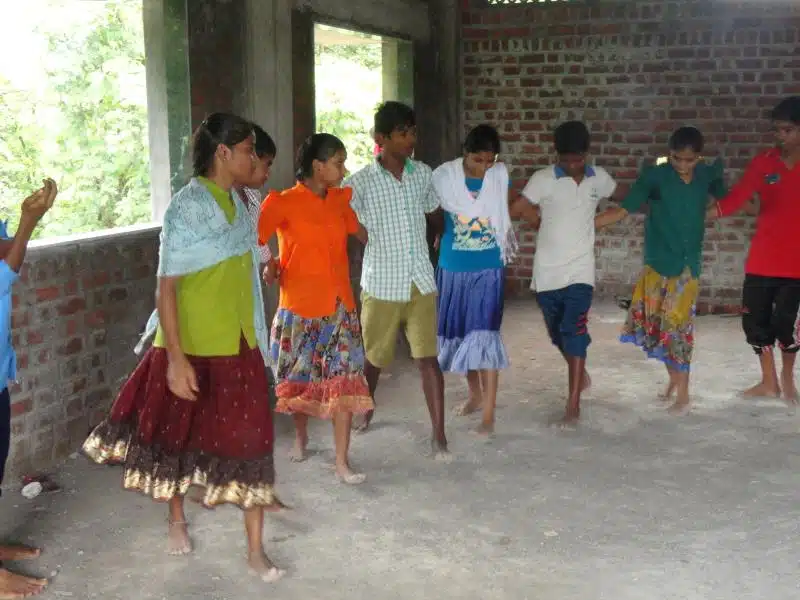 Children perform a dance